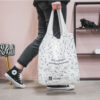 FOLDABLE BAG "SHOPAHOLIC" WHITE 65X43CM - Image 2